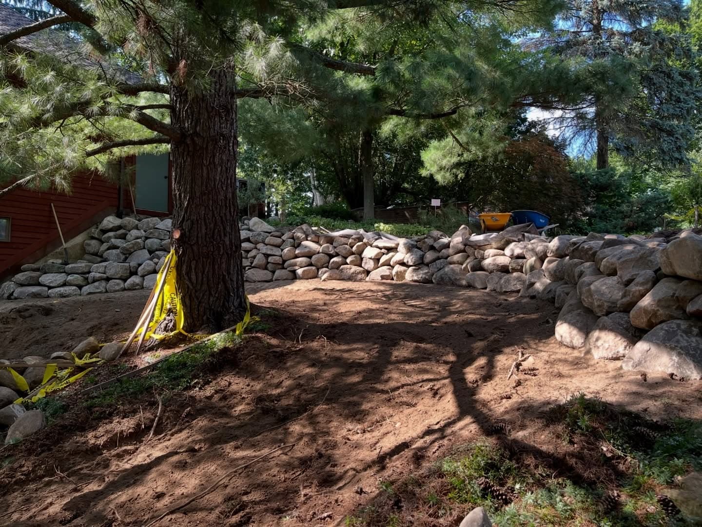 AquaPro Lawn Care boulder retaining wall installation in Metro Detroit